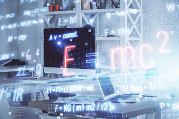 Desktop computer background and formula hologram writing. Double exposure. Education concept.