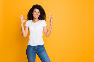 Photo of positive cheerful nice cute pretty sweet girl in jeans denim white t-shirt showing double...