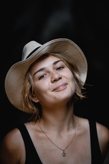 portrait of a young smiling girl with blond short hair and a hat - 316954342