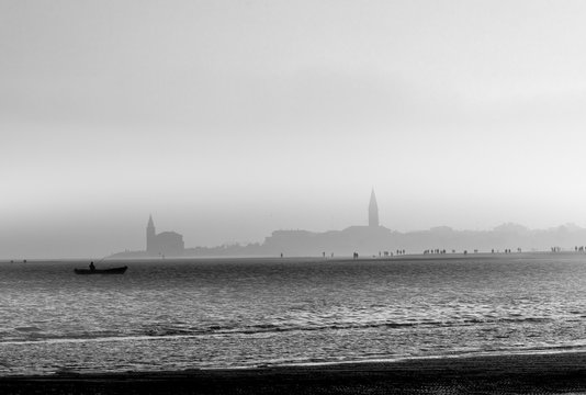 The promenade of Caorle on a evening of autumn, Santuario della Madonna dell'Angelo in background, Adriatic coast, Veneto, Italy, Europe