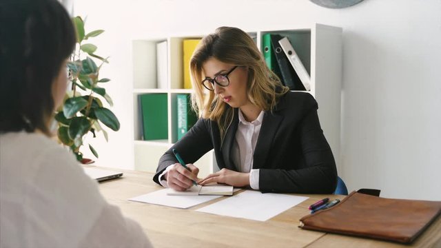 Young female candidate interviewed by employer
