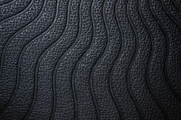 texture de cuir noir  avec des traits en forme de vague , arrière plan