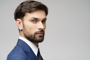 Studuo shot of thinking businessman wearing suit