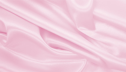 Smooth elegant pink silk or satin texture as wedding background. Luxurious background design