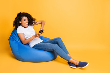 Full length body size turned photo of cheerful positive curly wavy trendy stylish overjoyed girl...