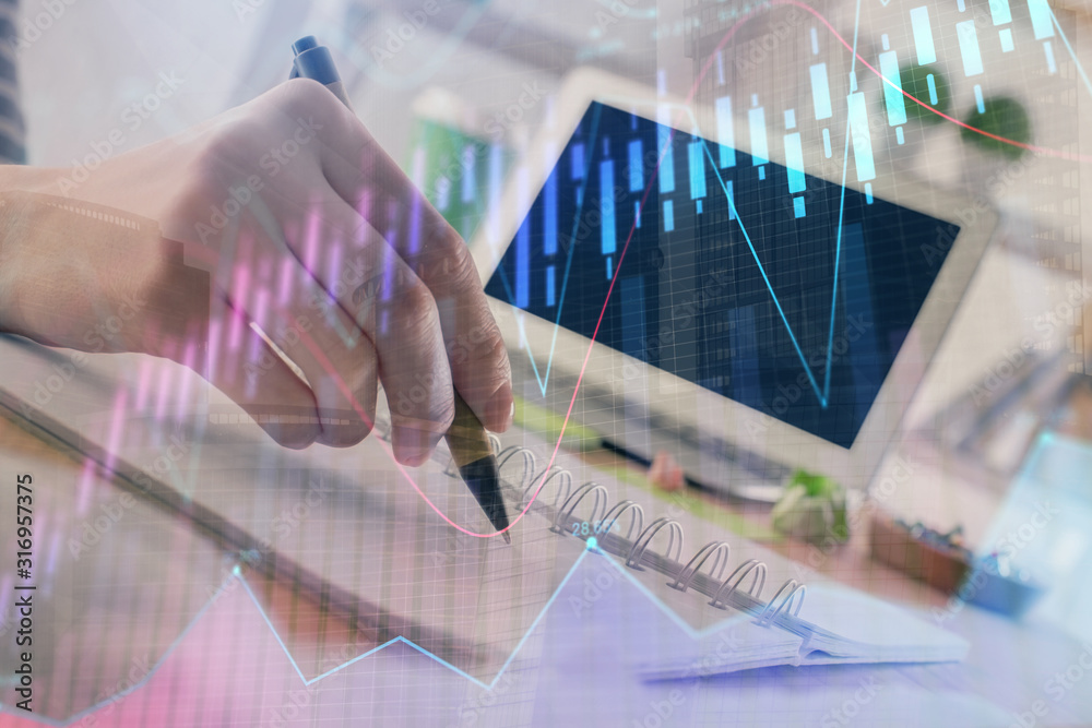 Wall mural financial forex graph drawn over hands taking notes background. concept of research. double exposure