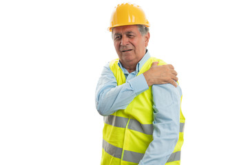 Builder touching painful arm