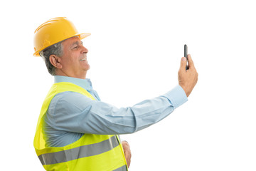 Construction worker taking selfie