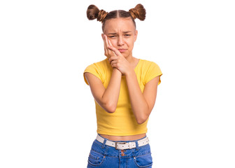 Portrait of teen girl touching face suffering toothache looking tired and sad. Dental problem. Unhappy beautiful caucasian young teenager suffering from tooth pain, isolated on white background.