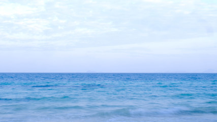 Fototapeta na wymiar The balance of the sky and the calm blue sea