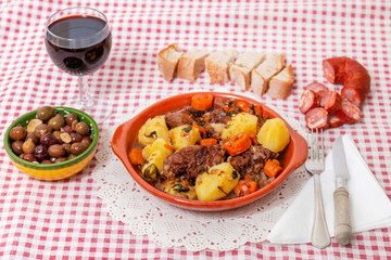 rustic meal of ox tail with potato and carrot