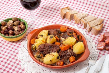 rustic meal of ox tail with potato and carrot