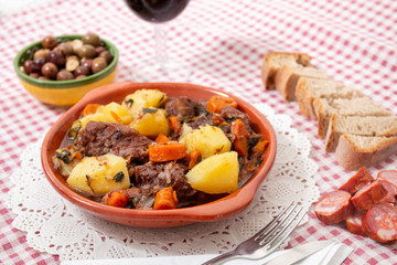 rustic meal of ox tail with potato and carrot