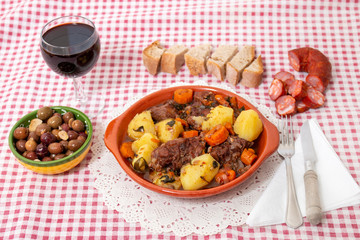 rustic meal of ox tail with potato and carrot