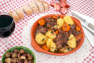 rustic meal of ox tail with potato and carrot