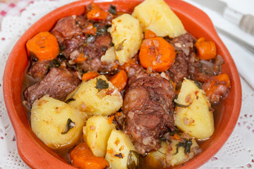 rustic meal of ox tail with potato and carrot