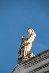 marble statues on top of building