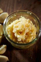 Crushed garlic in plastic bowl 