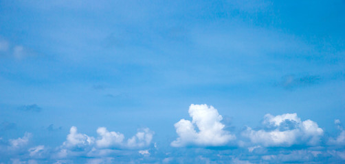 Naklejka na ściany i meble Blue sky background with tiny clouds. clouds in the blue sky