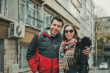 Young couple looking and smiling to the camera with self confidence