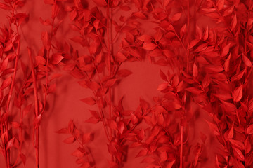 Floral background branches with spring leaves coloured in red