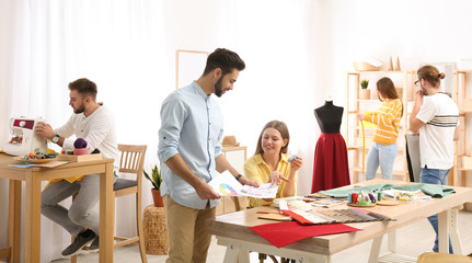 Fototapeta premium Fashion designers creating new clothes in studio