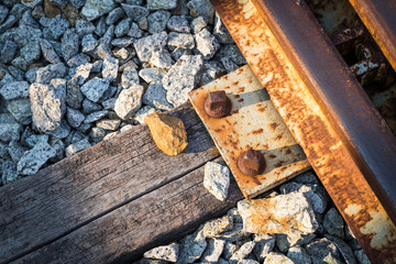 Old rusty nut and bolt on railway