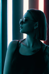 Fashion portrait of young attractive girl in sunglasses