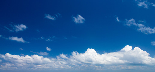 Blue sky background with tiny clouds. clouds in the blue sky