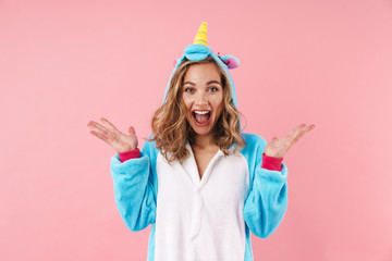 Image of caucasian excited woman screaming while expressing surprise © Drobot Dean
