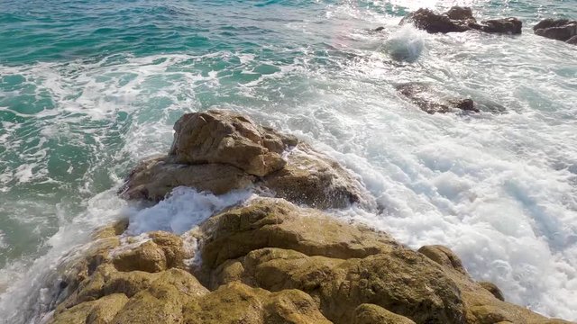 beautiful mediterranean sand beach ,maresme barcelona, san pol de mar, with rocks and calm sea and turquoise , costa brava calella