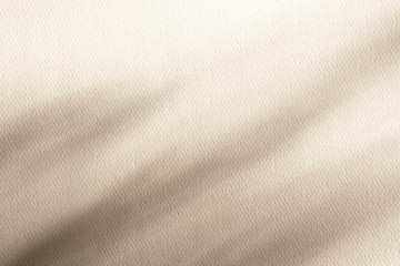 High quality paper textured background with shadows, light pastel beige color. Overlay effect for...