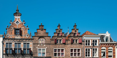 Obraz premium stepped gable houses and Kerkboog Gate on square Grote Markt in Nijmegen, The Netherland