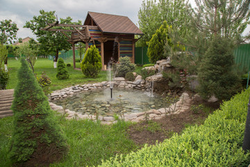 Beautiful nature with a fountain in the country cottage