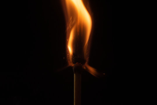 Ignition of match with sparks isolated on black background space for text fire concept passion figures variety