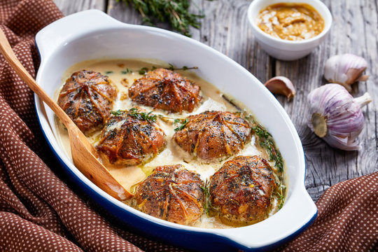 rabbit ballotine in a ceramic baking dish
