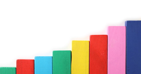 Colorful wooden building blocks business, financial chart isolated on white background, top view