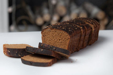 Fresh brown bread slice isolated on white background