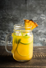 Pineapple mojito cocktail in jar. Selective focus. Shallow depth of field.