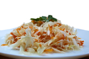 Shredded coleslaw with carrots sauerkraut in a plate