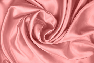 Beautiful smooth elegant pink silk or satin texture can use as abstract background for design