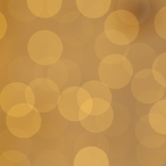 Christmas light background with holiday glowing backdrop. Defocused background with golden blinking stars