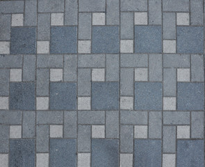 Concrete paving slabs of different sizes. Pedestrian road texture