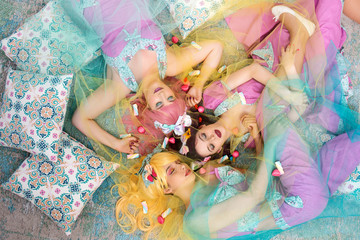 Pinup girls with colorful outfits.