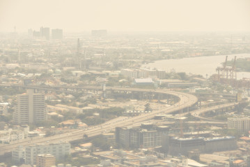 Bangkok / Thailand - 8 March 2019: Bird's eye view to show Bangkok's dusty city view, harmful PM2.5, harmful to the body, dust, smoke, unhealthy air pollution in the city.