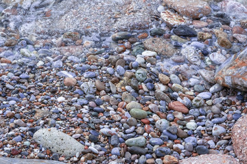 abstract sea background with stones underwater and on the shore