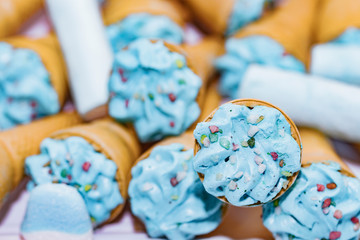 Blue trifle ice cream cones as props for a party.