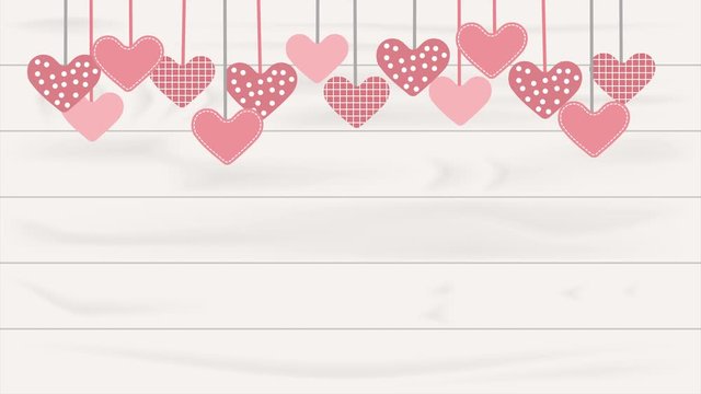 Hearts hanging on the white wooden background. Valentine&rsquo;s Day concept