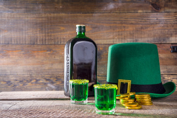 Drinks for St. Patrick's Day party. Good luck leprechaun shot cocktail. Green strong drink in a...