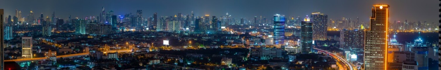 Fototapeta na wymiar Panorama view of Bangkok business district at night time.